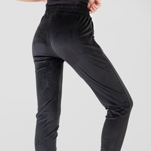Czarne damskie spodnie dresowe ze srebrnym napisem - Odzież