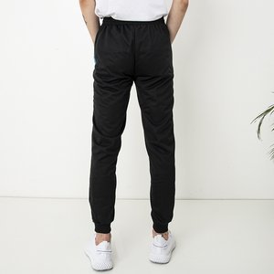 Czarne męskie spodnie dresowe z napisami - Odzież