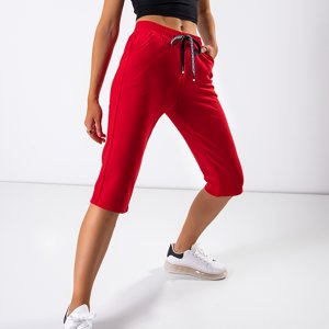 Czerwone damskie spodnie o długości 3/4 - Odzież