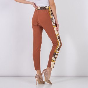 Jasnobrązowe wzorzyste damskie spodnie - Odzież