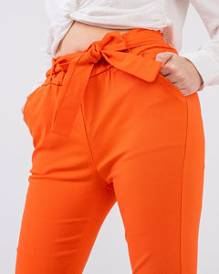 Materiałowe spodnie damskie z wysokim stanem w kolorze pomarańczowym - Odzież