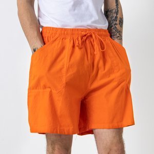 Pomarańczowe męskie krótkie spodenki z kieszeniami - Odzież