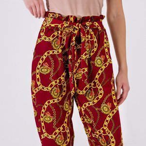 Royalfashion Bordowe damskie spodnie z printem